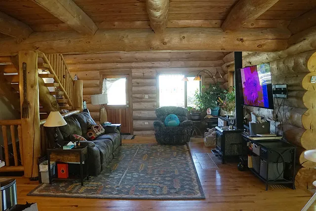 a view of sitting area in back yard of a house