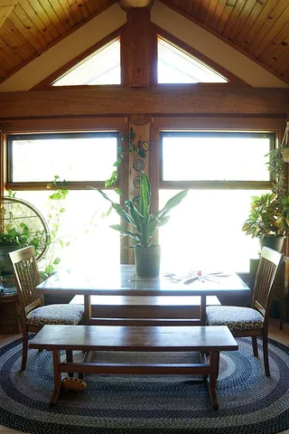 a view of living room with furniture and a window