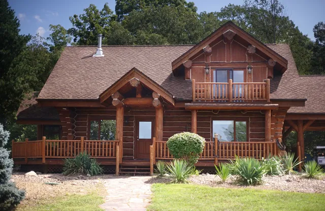 a view of a house with a wooden deck