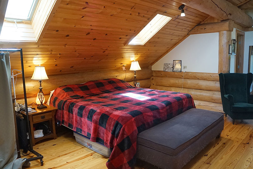 3526 East 2179th Road Ottawa, IL 61350 - Photo 28 of 58 a bed sitting in a bedroom next to a window