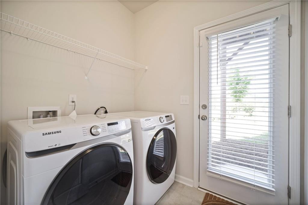 1595 Ridgebrook Downs Mableton, GA 30126 - Photo 29 of 39 a utility room with dryer and washer