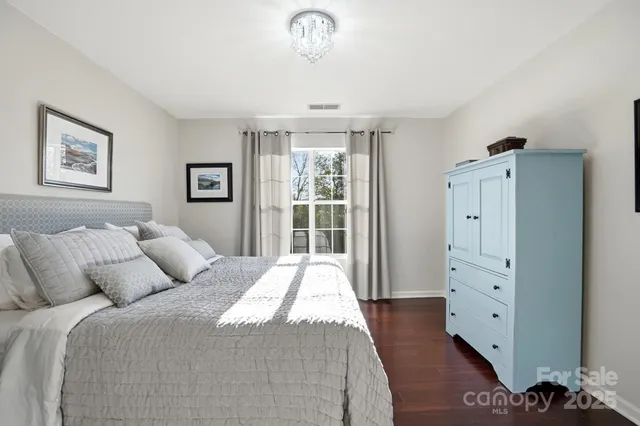 a bathroom with a double vanity sink a mirror and shower