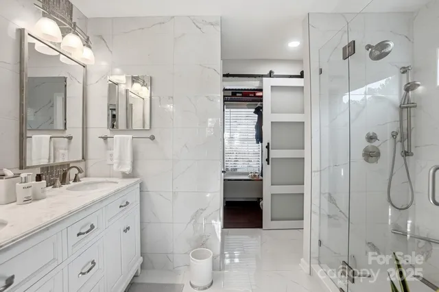 a bathroom with a sink a vanity and a mirror