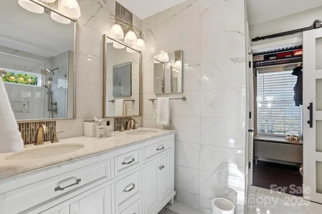 a view of living room with furniture and a potted plant