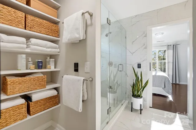 a bathroom with a shower and a sink