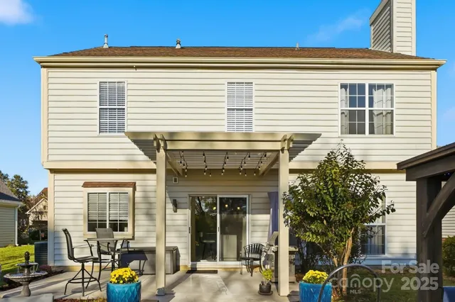 an aerial view of residential houses with yard