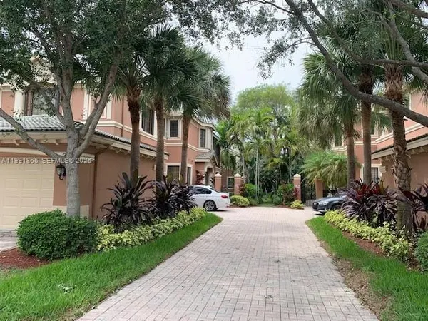 a view of a house with a tree
