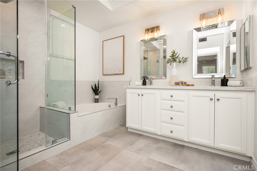 268 Lockford Irvine, CA 92602 - Photo 5 of 5 a bathroom with a double vanity sink a mirror and a bathtub