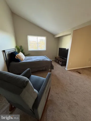 a white toilet sitting next to a bath tub and a shower