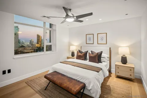 a bedroom with a bed and a window