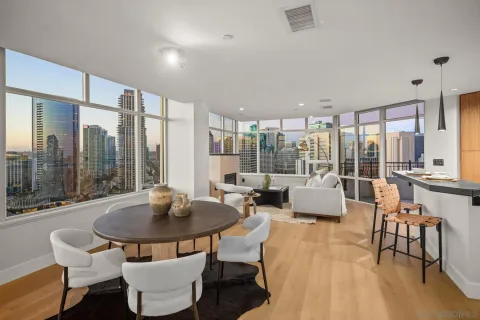 a living room with fireplace furniture and a table