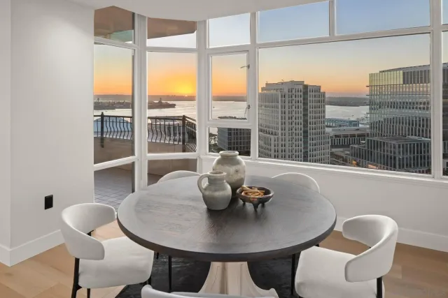 a view of a dining room with furniture window and outside view