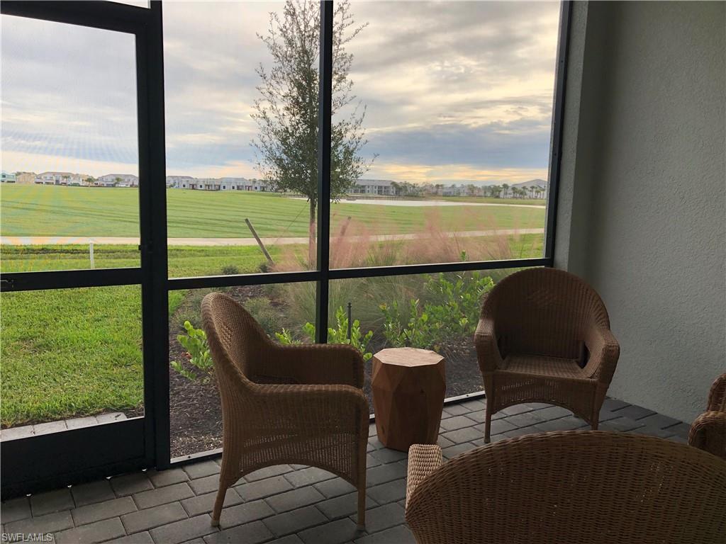 43031 Greenway Boulevard, Unit 1014 Babcock Ranch, FL 33982 - Photo 1 of 19 a view of a chair and table in the balcony