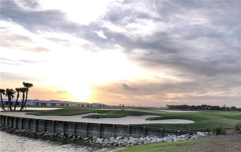 43031 Greenway Boulevard, Unit 1014 Babcock Ranch, FL 33982 - Photo 12 of 19 a view of a lake with a big yard