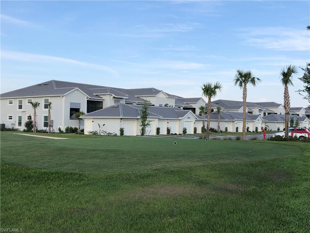 43031 Greenway Boulevard, Unit 1014 Babcock Ranch, FL 33982 - Photo 14 of 19 a view of a big house with a big yard