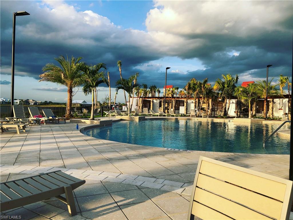 43031 Greenway Boulevard, Unit 1014 Babcock Ranch, FL 33982 - Photo 16 of 19 a view of swimming pool with outdoor seating
