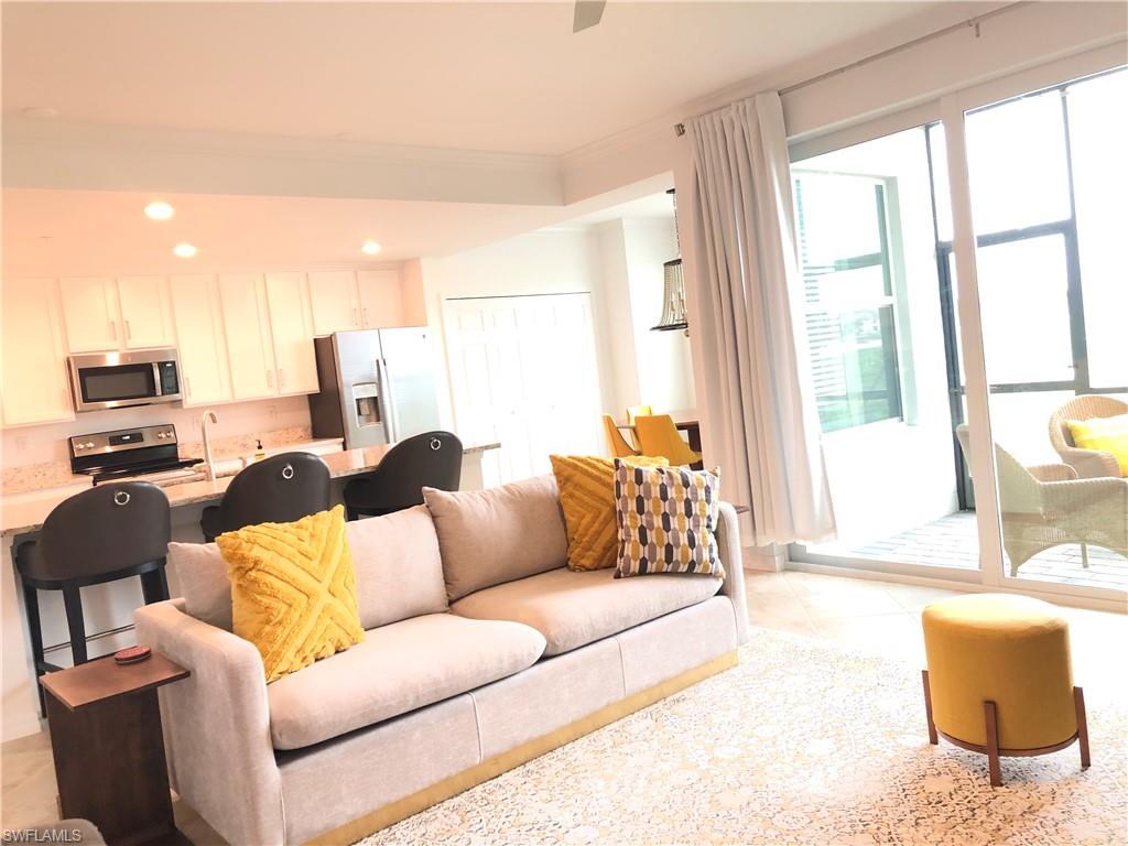 43031 Greenway Boulevard, Unit 1014 Babcock Ranch, FL 33982 - Photo 3 of 19 a living room with furniture and a large window