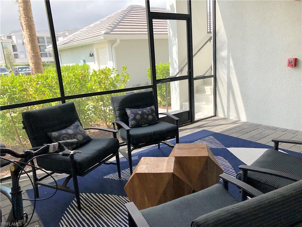 43031 Greenway Boulevard, Unit 1014 Babcock Ranch, FL 33982 - Photo 4 of 19 a living room with furniture and a window