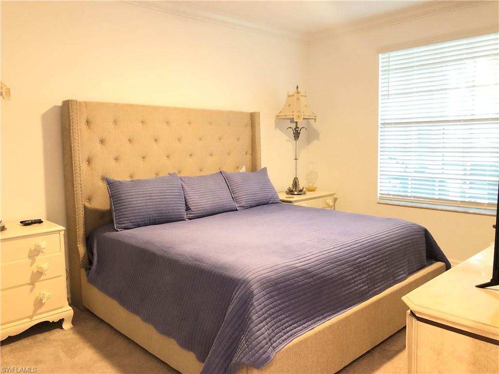 43031 Greenway Boulevard, Unit 1014 Babcock Ranch, FL 33982 - Photo 7 of 19 a bedroom with a bed and a window