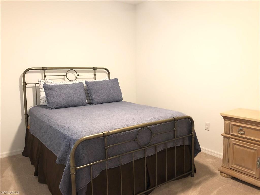 43031 Greenway Boulevard, Unit 1014 Babcock Ranch, FL 33982 - Photo 10 of 19 a bedroom with a bed and with furniture