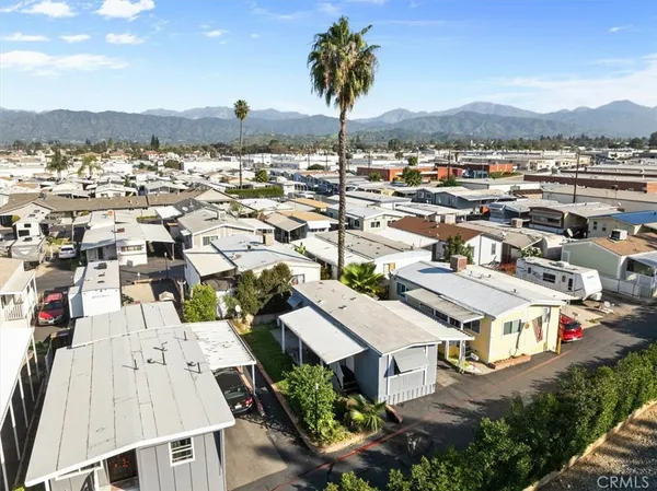 an aerial view of a residential houses with city view and lake view