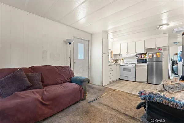 a bedroom with furniture and a chair