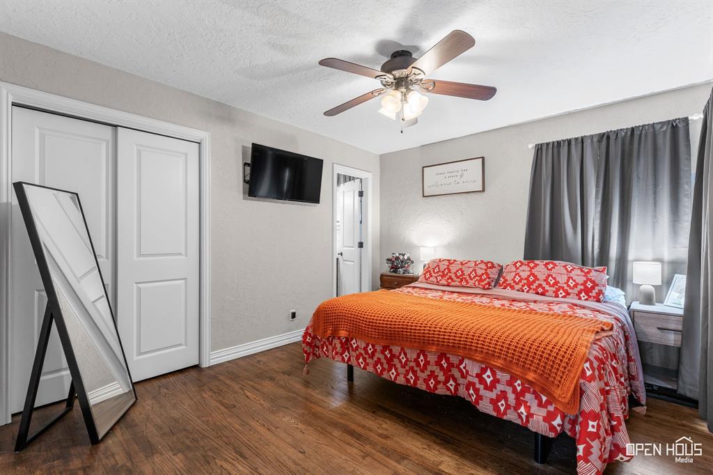 4419 Randel Drive Wichita Falls, TX 76308 - Photo 10 of 32 Wood-finish flooring with white trim, two-panel interior doors, and a ceiling fan with integrated lighting