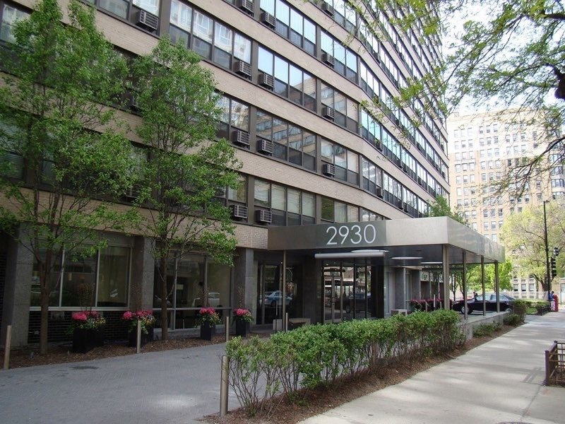 a view of a building with a garden