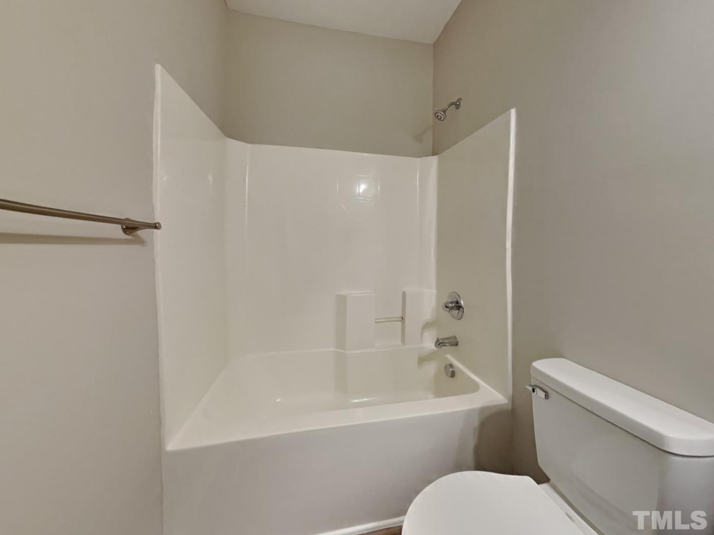 180 Crane Way Bunnlevel, NC 28323 - Photo 16 of 18 a bathroom with a toilet and a bathtub