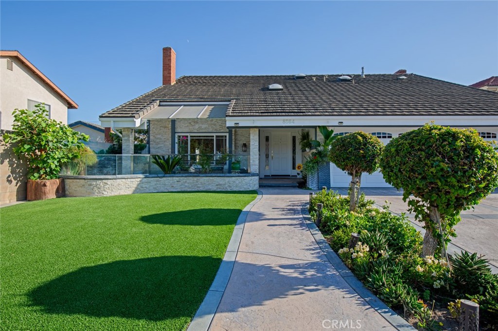 8564 Ostrich Circle Fountain Valley, CA 92708 - Photo 1 of 1 a front view of a house with a yard