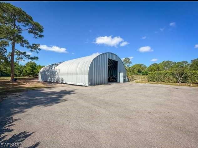 3790 35th Avenue Northeast Naples, FL 34120 - Photo 6 of 27 a view of a house with a yard