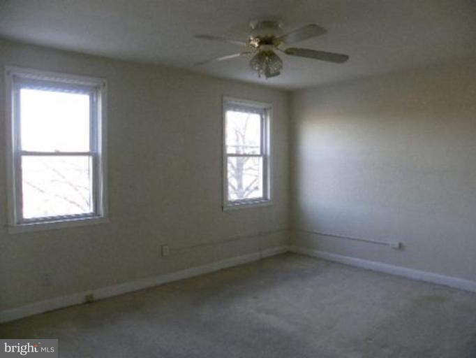 4842 Greencrest Road Baltimore, MD 21206 - Photo 12 of 14 an empty room with a window