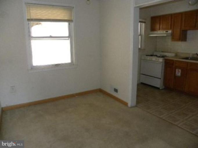 4842 Greencrest Road Baltimore, MD 21206 - Photo 4 of 14 an empty room with a window