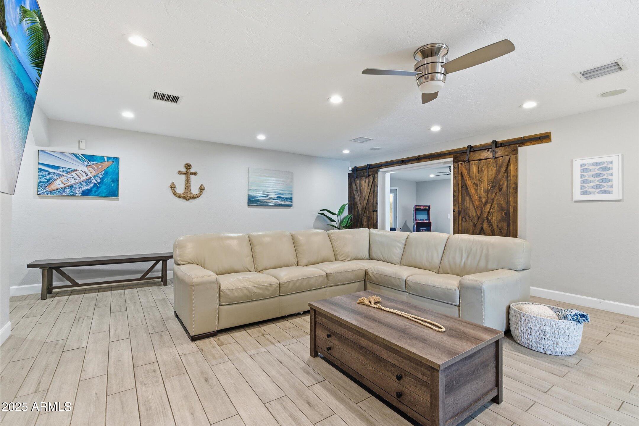 2530 North 68th Place Scottsdale, AZ 85257 - Photo 13 of 52 a living room with furniture and a wooden floor