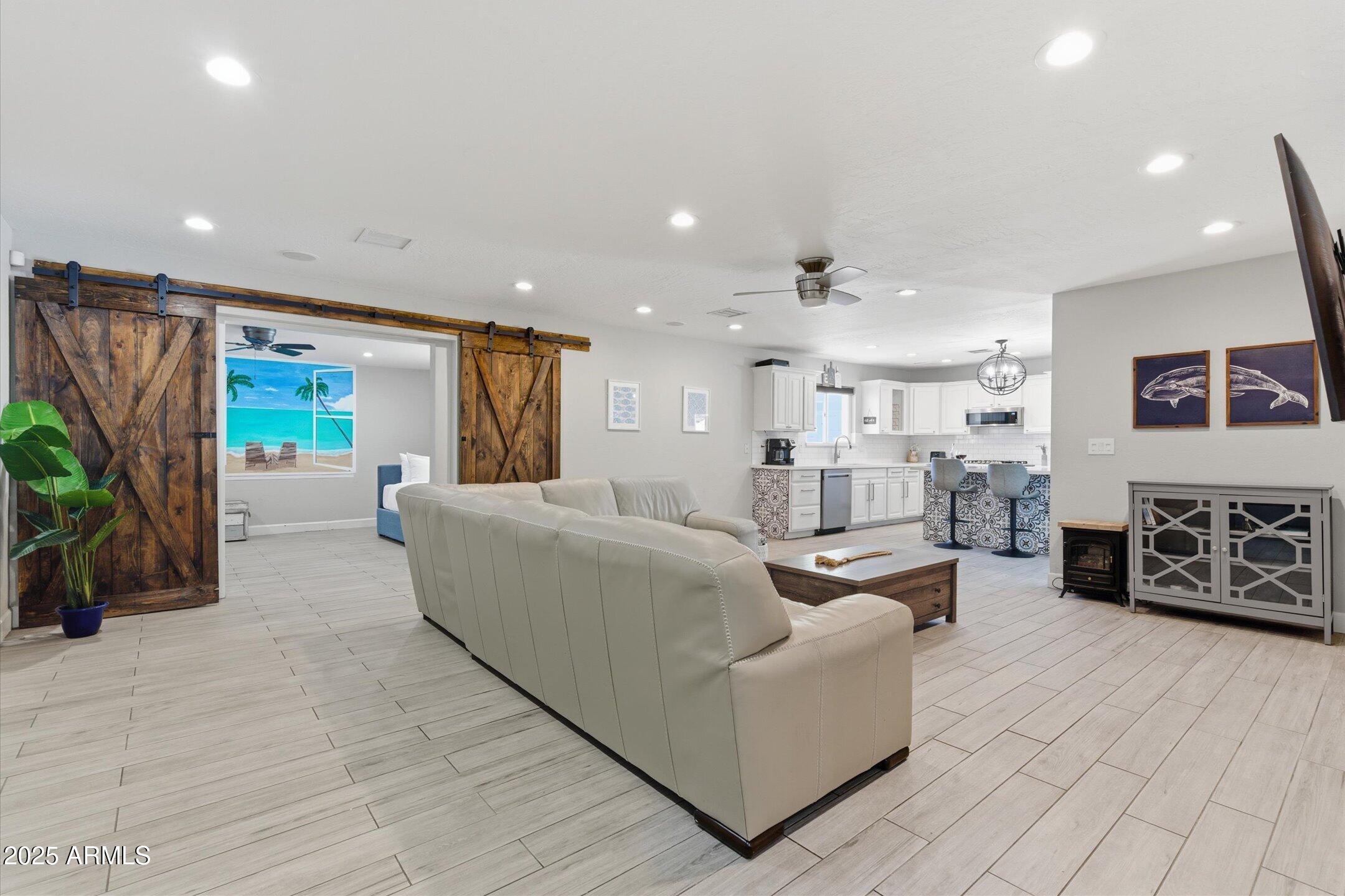 2530 North 68th Place Scottsdale, AZ 85257 - Photo 14 of 52 a living room with furniture and a flat screen tv