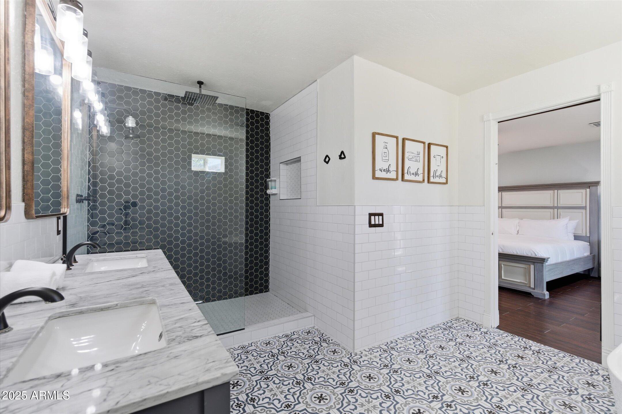 2530 North 68th Place Scottsdale, AZ 85257 - Photo 21 of 52 a bathroom with a sink and a mirror