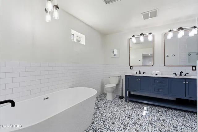 a bathroom with a bathtub and shower