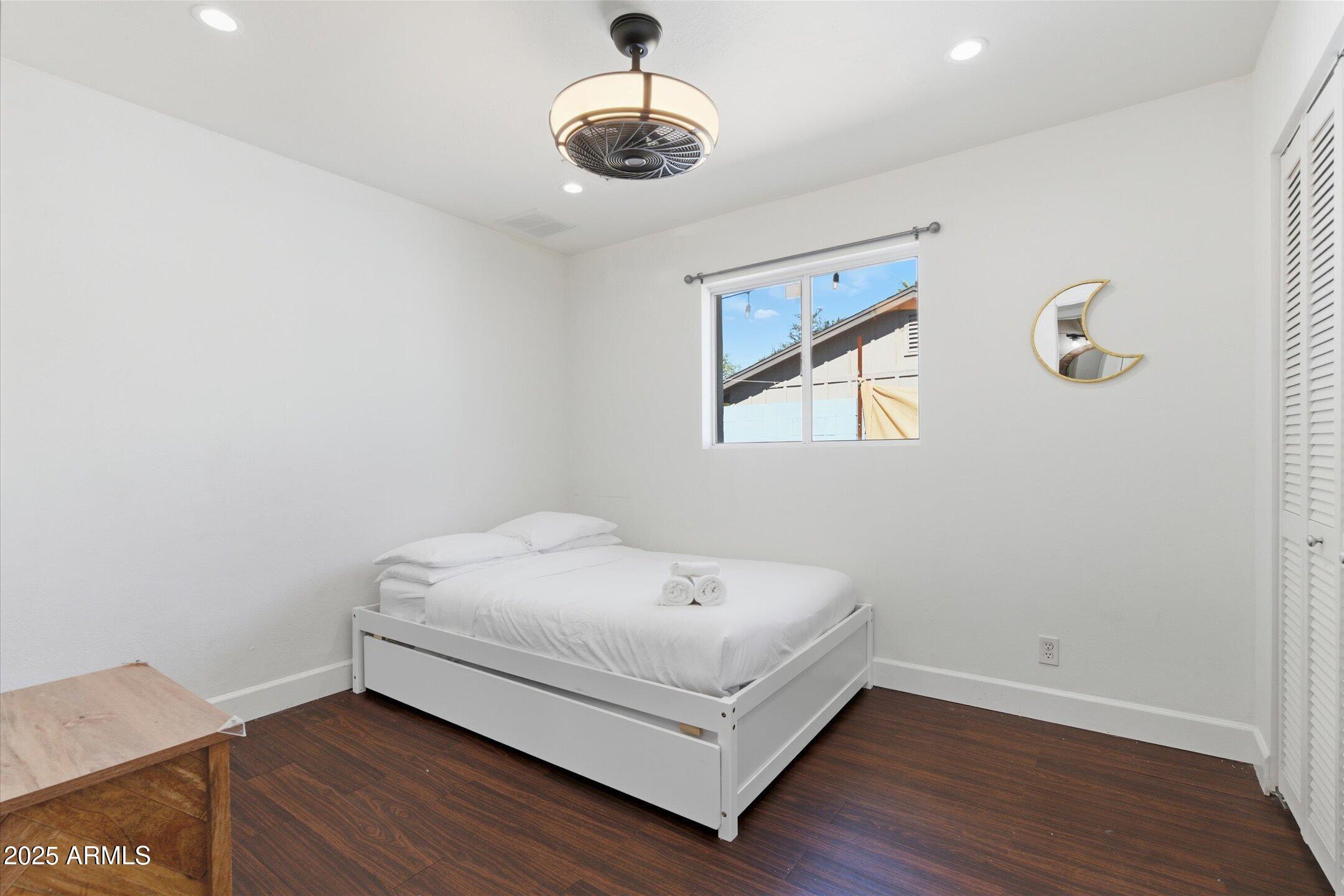 2530 North 68th Place Scottsdale, AZ 85257 - Photo 29 of 52 a bedroom with a bed and a window