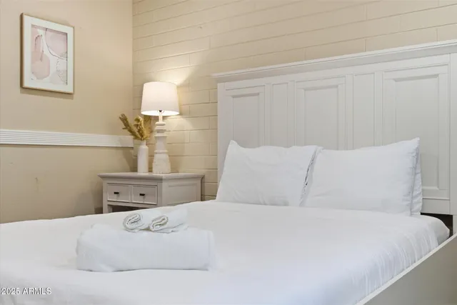 a bathroom with a sink a mirror a toilet and a shower