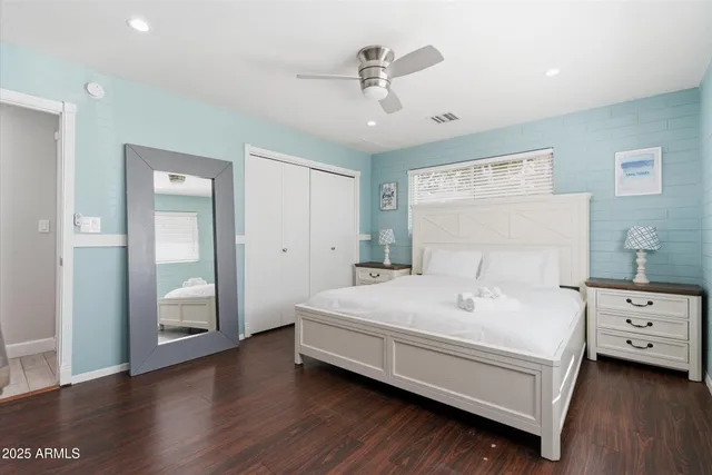 a bedroom with a bed and a dresser