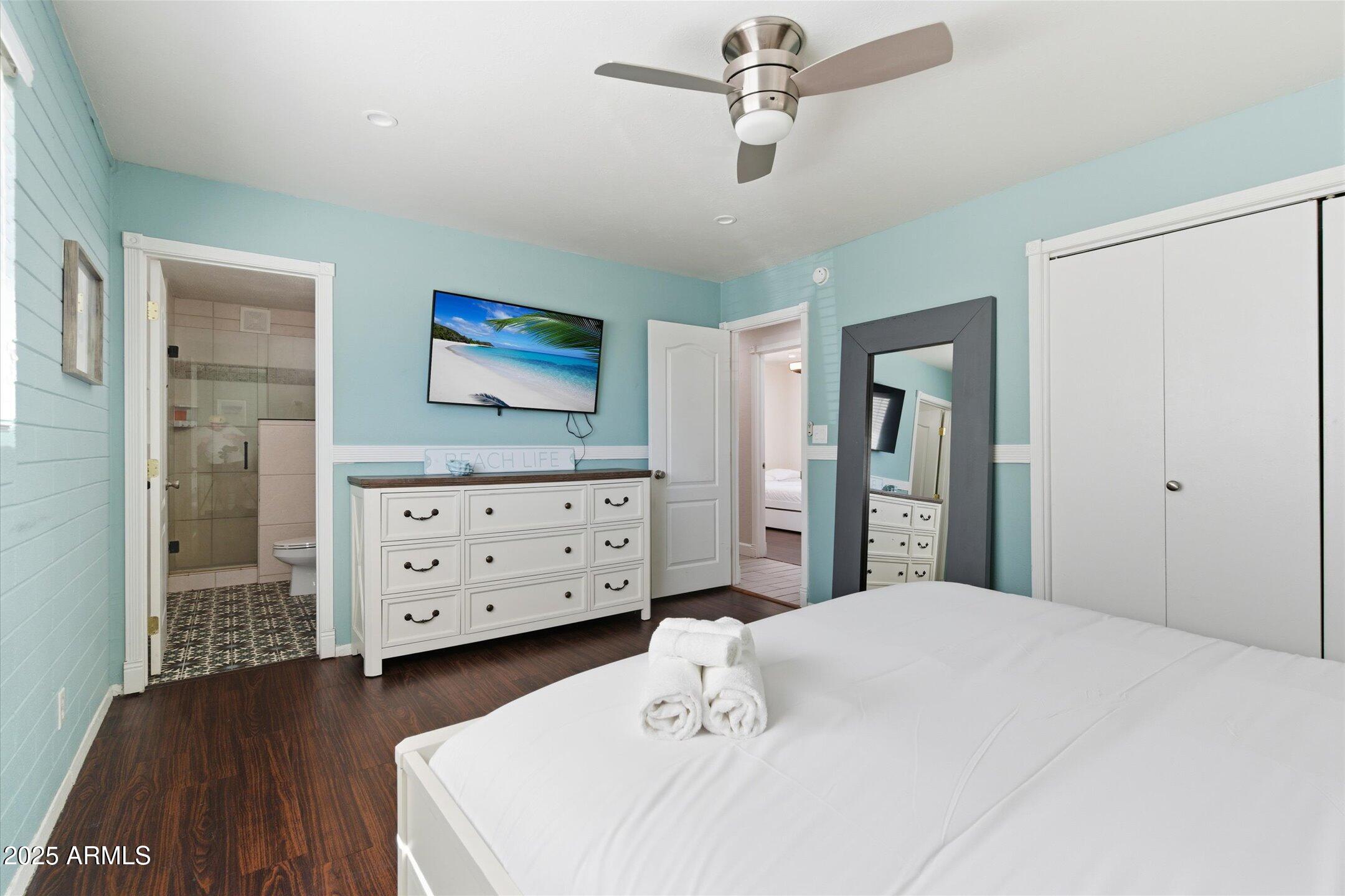 2530 North 68th Place Scottsdale, AZ 85257 - Photo 38 of 52 a bedroom with a bed and a dresser