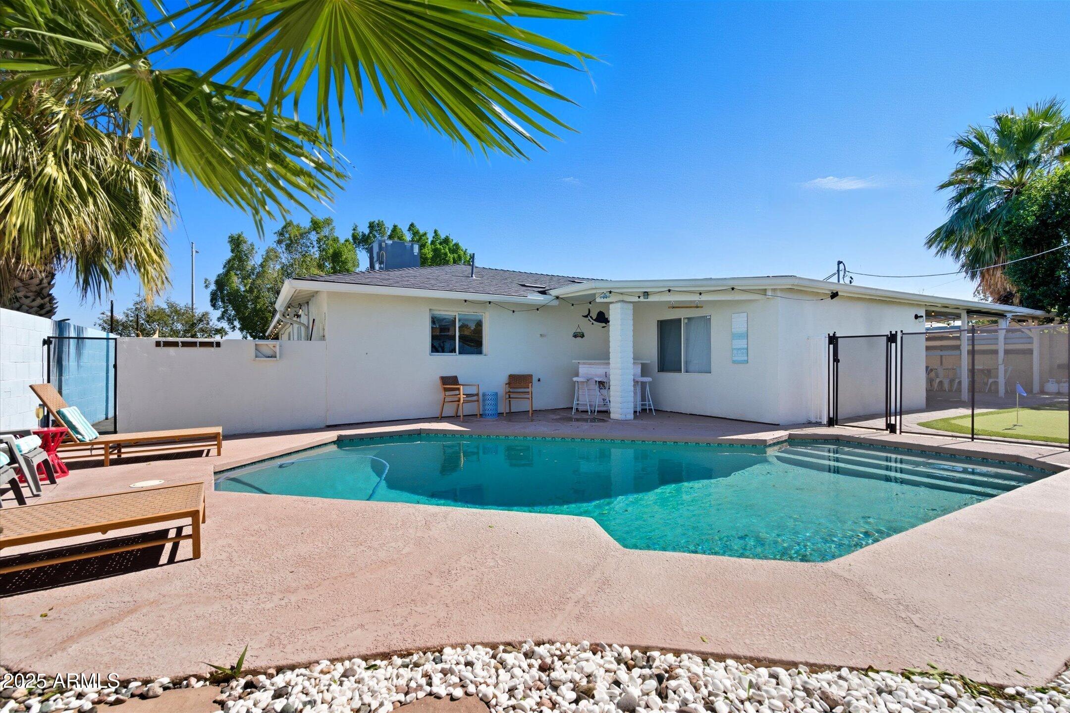 2530 North 68th Place Scottsdale, AZ 85257 - Photo 43 of 52 a view of a house with a yard and sitting area