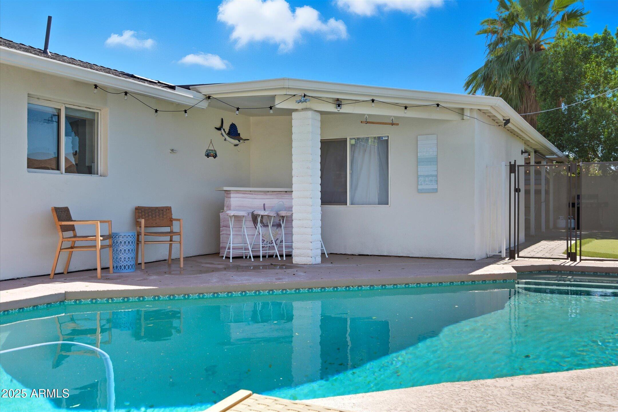 2530 North 68th Place Scottsdale, AZ 85257 - Photo 45 of 52 a backyard of a house with table and chairs