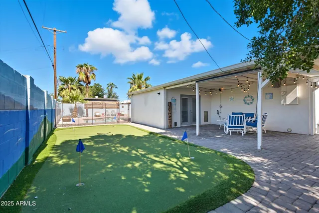 a wooden bench sitting in a room next to a window