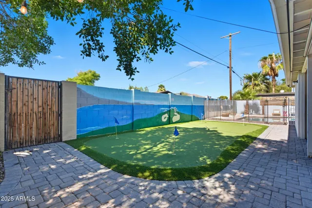 a view of a patio with a table and chairs