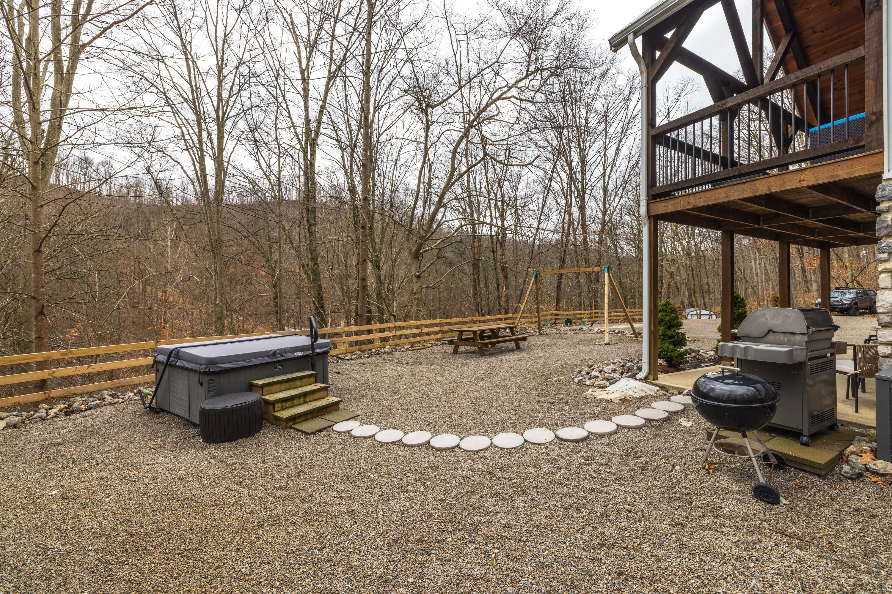 344 Skaggs Road Londonderry, OH 45647 - Photo 48 of 57 Sage Hill Cabin hot tub and grilling area