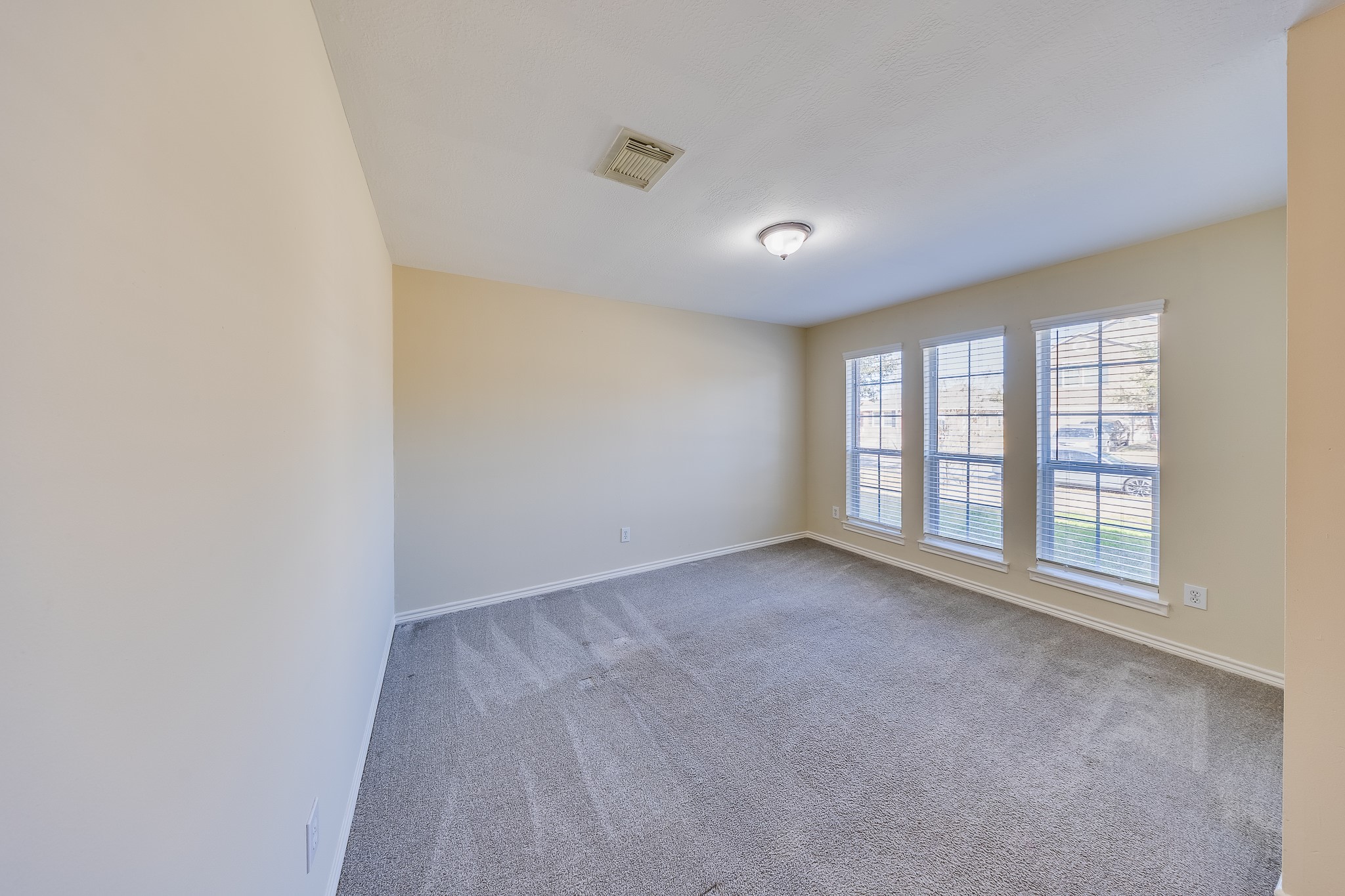 20003 Rustic Lake Lane Cypress, TX 77433 - Photo 11 of 21 wooden floor in an empty room with a window