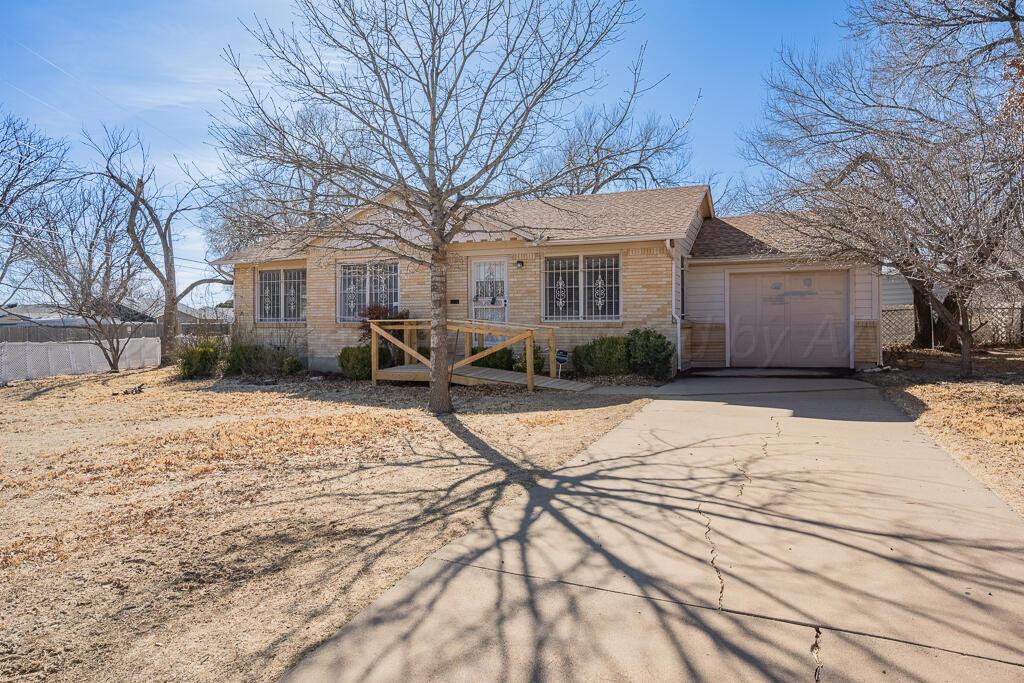 1606 Tularosa Street Amarillo, TX 79102 - Photo 1 of 22 a pathway of house with yard covered in snow