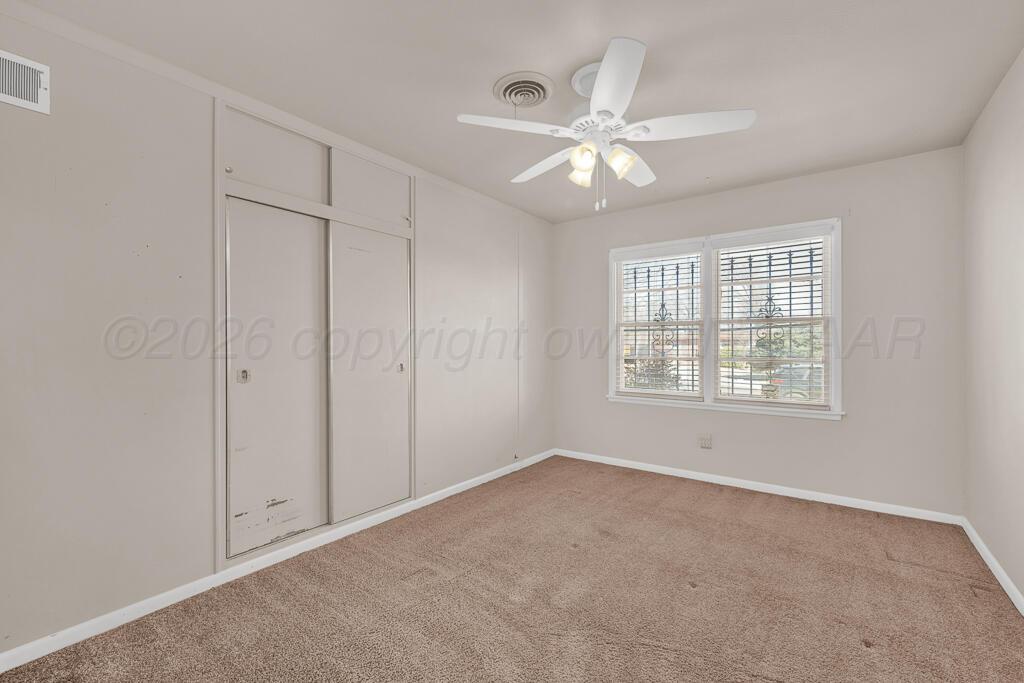 1606 Tularosa Street Amarillo, TX 79102 - Photo 5 of 22 a view of an empty room with a window