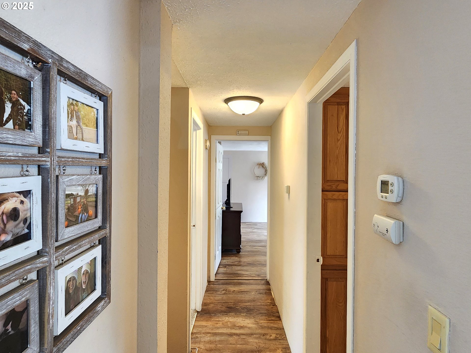 1809 26th Street, Unit 21 La Grande, OR 97850 - Photo 17 of 18 a view of a hallway with wooden floor and living room